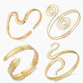 4-Piece Gold Arm Cuff Set | Wave, Spiral, Feather & Snake